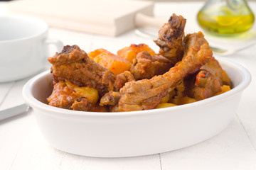 horizontal pork stew in white earthenware oven