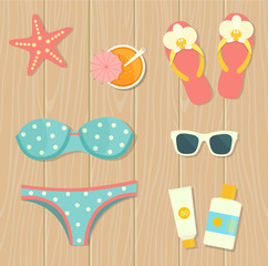 Vector flat illustration of flip flops, sunglasses and bikini on the wooden background , top view.