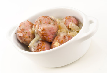 pot cooked meatballs in sauce, isolated