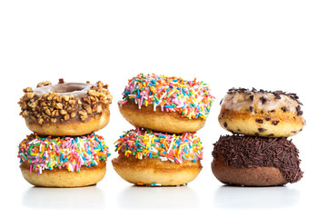 various donuts on white background