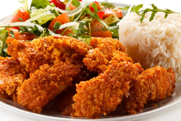 Fried chicken nuggets and vegetables