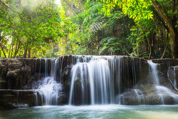 Waterfall deep forest scenic natural sunlight at huai mae khamin national park, kanchanaburi, thailand