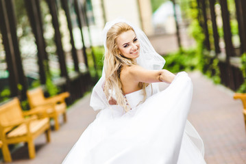 Elegant bride dancing and posing