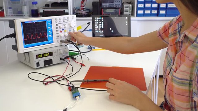 Girl solder and repair electronic device