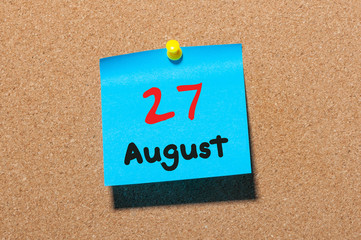 August 27th. Day 27 of month, color sticker calendar on notice board. Summer time. Empty space for text