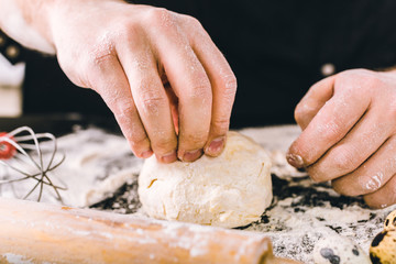 Hands kneading a dough