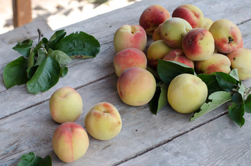 Ripe peaches on a gray wooden table