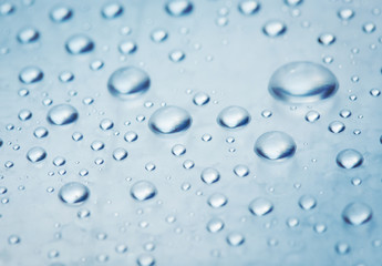 drops of water on a light surface