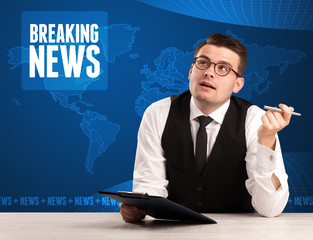 Television presenter in front telling breaking news with blue mo