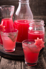 Watermelon drink in glasses with slices of watermelon mint and lemon, vintage background ,soft focus