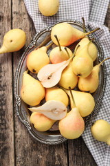 ripe pears on vitage wooden table