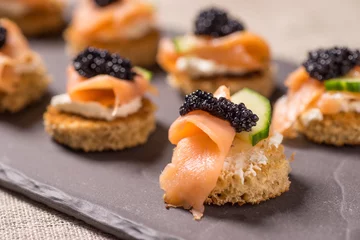 Wall murals Starter Smoked Salmon Canapes with Sour Cream and Caviar