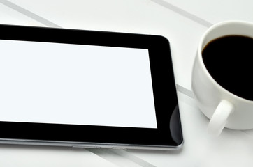 Fototapeta na wymiar Empty tablet with coffee cup