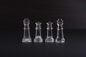 chess piece on black background with dramatic low light effect.