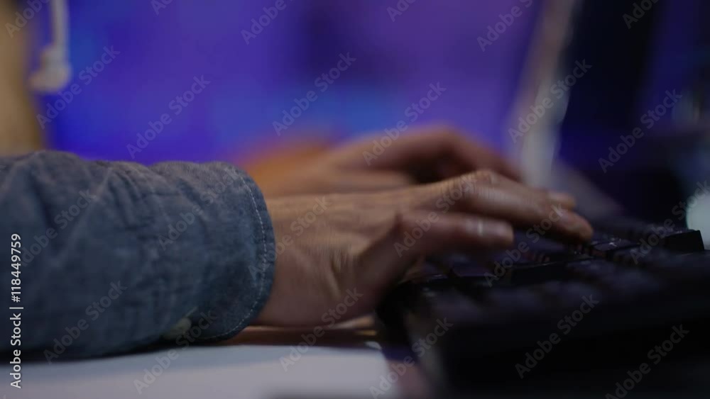 Wall mural close up on hands of unrecognizable person working on computer