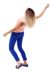 Balancing young woman.  or dodge falling woman. Rear view people collection.  backside view of person.  Isolated over white background. The blonde in a pink t-shirt curved back.