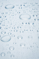 drops of water on a light surface
