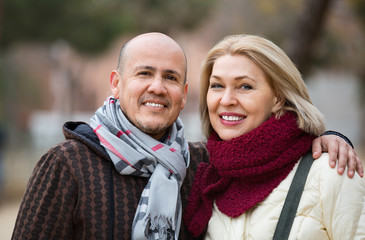 Fototapeta premium Portrait of smiling mature couple in city