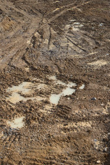 Wet dirt ground of construction site