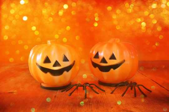 Halloween holiday concept. Cute pumpkins on wooden table