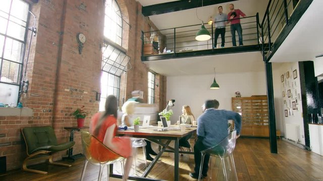 	 Time lapse of busy business team in creative office