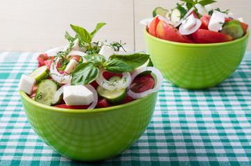 Vegetable vegetarian salad with raw tomato and cucumber