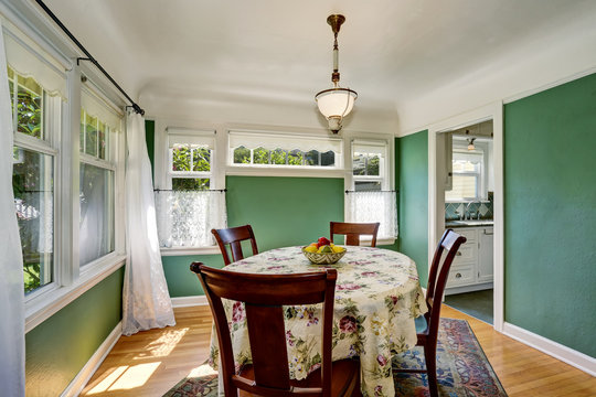 Traditional dining area with wooden table set. Open floor plan.
