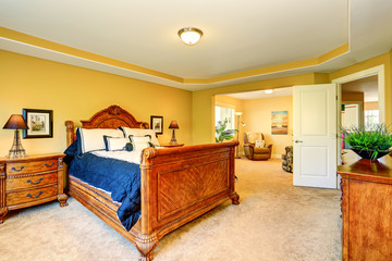 Gorgeous Interior of master bedroom with carved wood bed