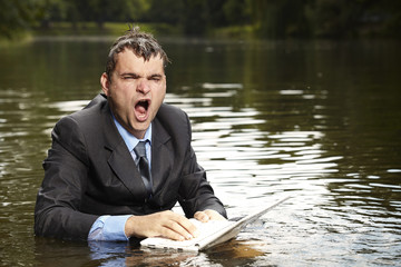 Crazy businessman in suit after burning out