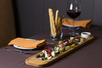 Antipasto and catering platter with different meat and cheese products 