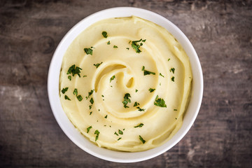Mashed potato on wooden background

