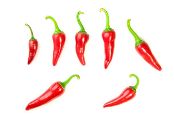 Many ripe red  Chilli peppers on white