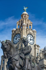 Statue of Edward VII against the Liver Building, Liverpool, Engl