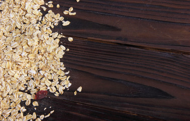 oat flakes on wooden background.free space