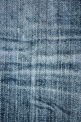 Naklejka premium Background texture of blue jeans