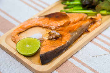 Grilled salmon with salad vegatable lime and salt