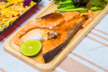 Delicious grilled of fresh salmon fillet with aromatic herbs