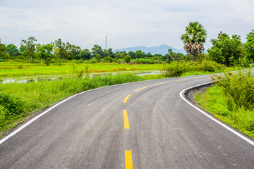 Fototapeta na wymiar Asphalt road on countryside in thailand.