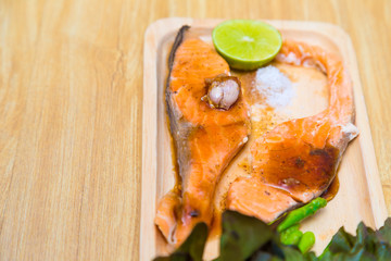 Grilled salmon with salad vegatable lime and salt