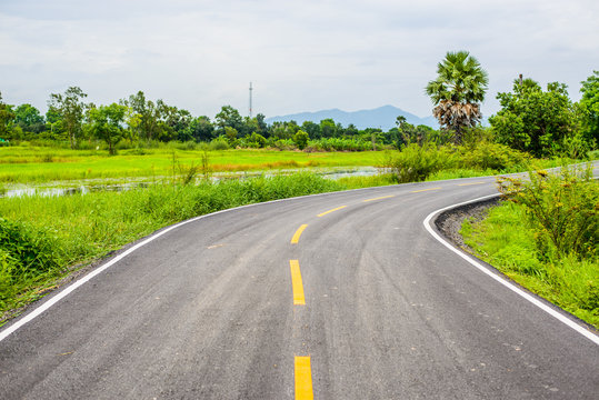 Asphalt road on countryside in thailand.