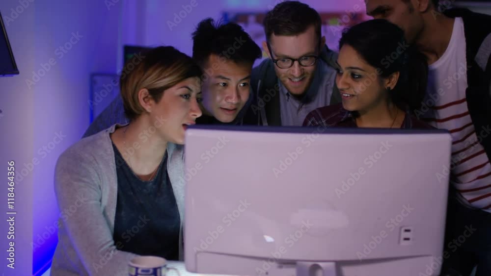 Wall mural team of young computer hackers trying to gain access to a computer system