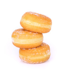 Three stacked sugared donuts over white background