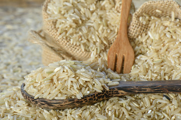Closeup Brown rice in wooden spoon