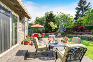 Well kept garden at backyard with concrete floor patio area