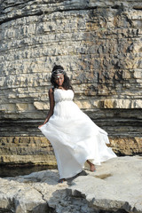 bride model wearing a white wedding dress on nature