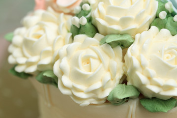 Close up of white flowers made from cream decorated on wedding o