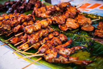 Grill chickens on marinade. Street outdoor food