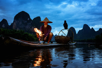 Fisherman of Guilin, Li River and Karst mountains during the blue hour of dawn,Guangxi  China