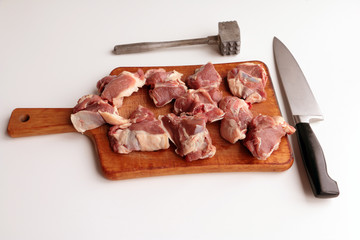 Lamb loin pieces on kitchen board