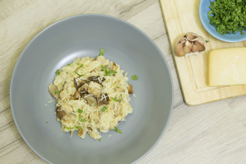Risotto with mushrooms, parmesan cheese and parsley